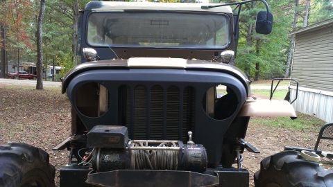 1978 Ford Bronco - This Jeep M38A1 has a distinctive grille and round headlights, not matching the 1978 Ford Bronco claim.