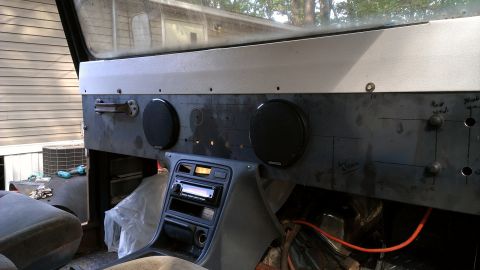 1978 Ford Bronco - Custom dashboard fabrication in progress, aftermarket speakers and a car stereo unit.