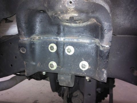 1993 Ford F-150 - Close-up view of a frame mount with visible bolts and welds.
