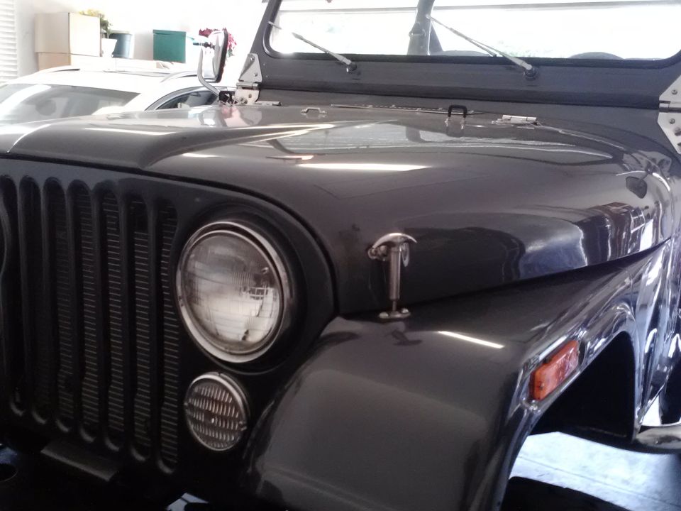 Dark gray Jeep CJ front grille and hood with chrome latches