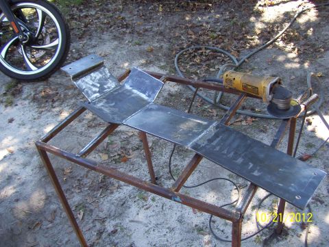 1990 Ford Bronco - A metal fabrication project is underway, with an angle grinder and a motorcycle wheel in the background. The date 10/21/2012 is visible.