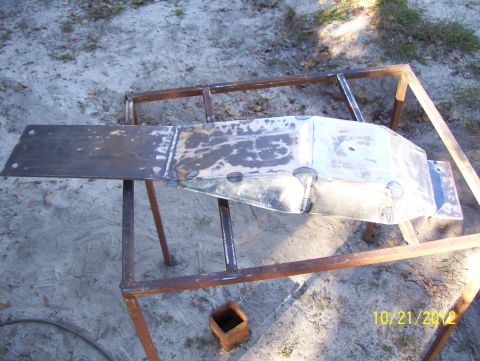 1990 Ford Bronco - Custom metal fabrication project in progress, resting on a metal stand outdoors.