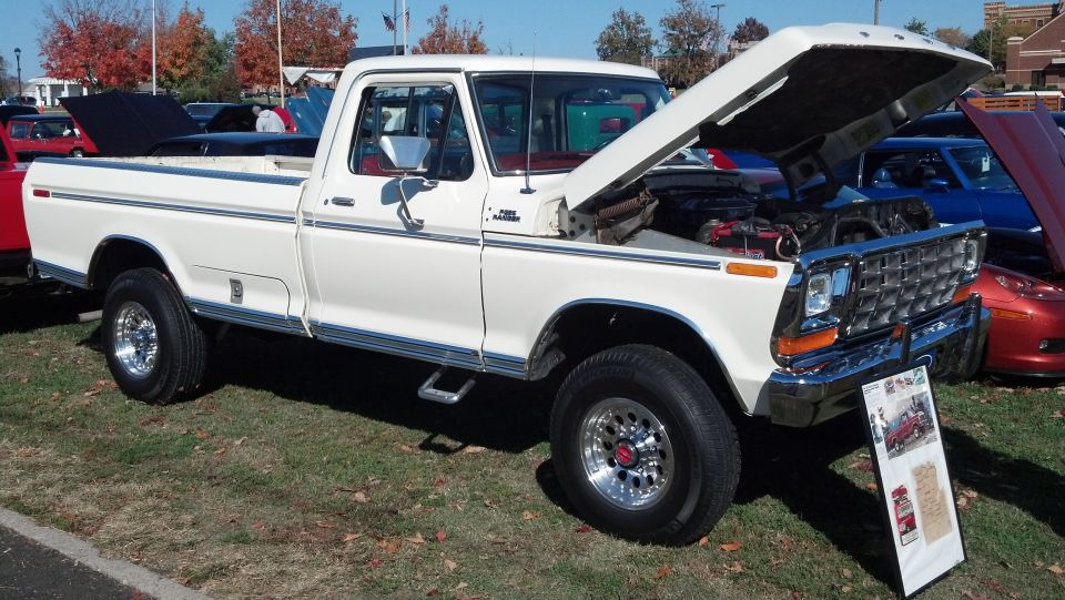 White 1979 Ford F-150 pickup truck, front 3/4 view, hood open