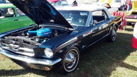 2007 Ford Mustang - A classic dark blue convertible is displayed with its hood open, revealing the engine compartment.
