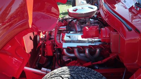 2007 Ford Mustang - Engine bay detail with V8 engine, chrome air cleaner, and exhaust headers.