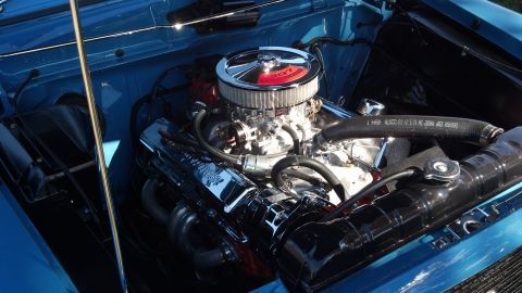 2007 Ford Mustang - Close-up of a blue engine bay a chrome air cleaner and valve covers.