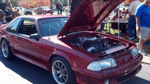 2007 Ford Mustang - Red coupe with hood open, showing engine and turbo. This is not a 2007 Ford Mustang.