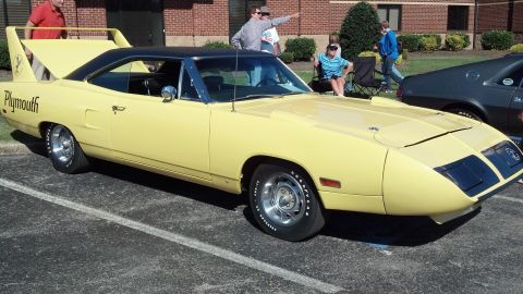 2007 Ford Mustang - 1970 Plymouth Superbird parked at an outdoor event with another car visible.