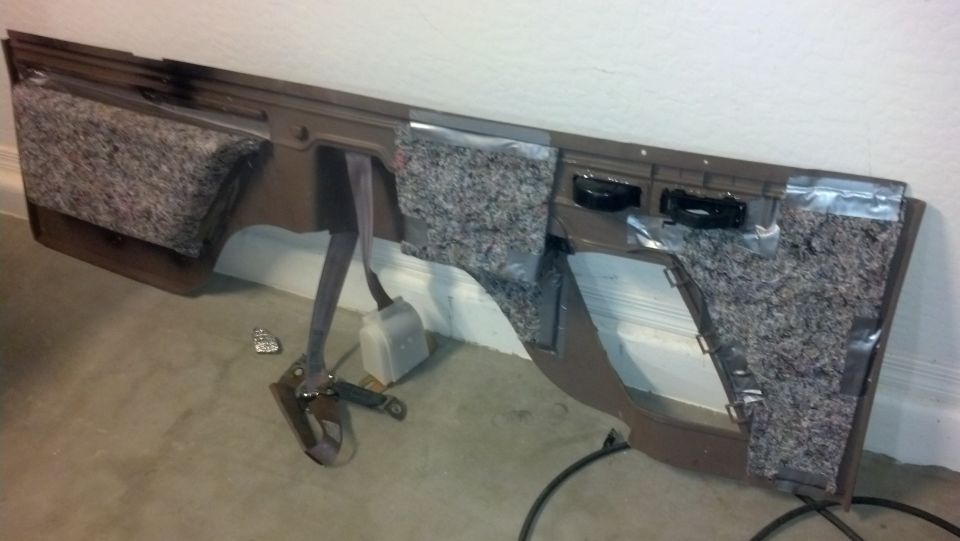 Brown door panel with insulation and seatbelt mechanism
