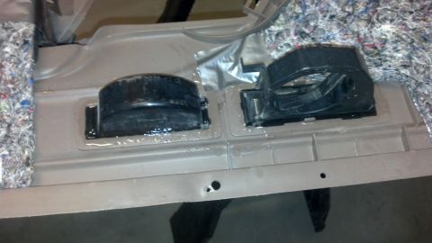 1995 Ford Bronco - Interior view of a car door panel with speaker mounts and insulation visible.