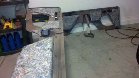 1995 Ford Bronco - Interior dashboard components are disassembled and laid out on the floor.