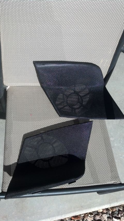 1995 Ford Bronco - Pair of car door speaker grilles shown on a chair.