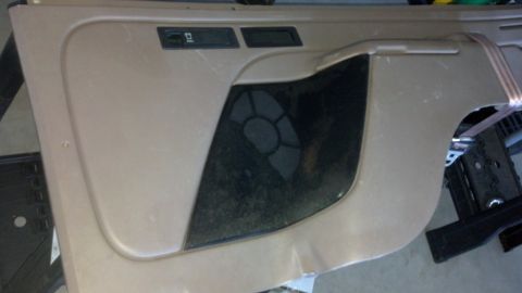 1995 Ford Bronco - Close-up of a car door panel, likely from an older model vehicle.