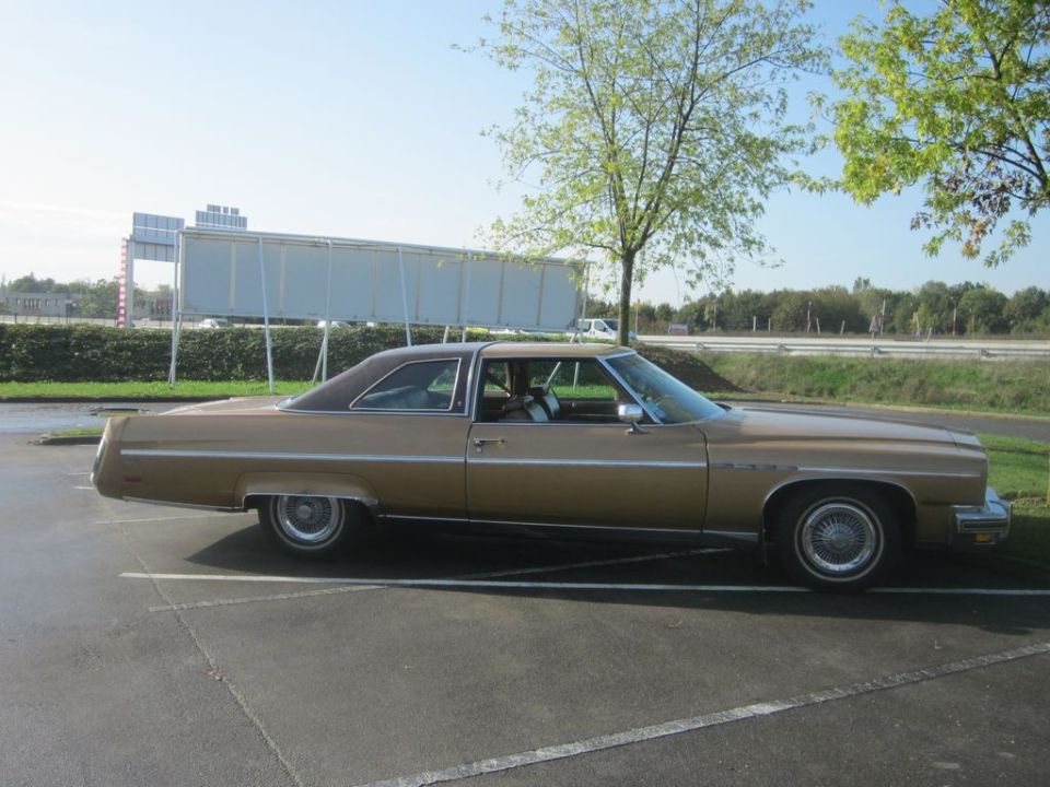 Brown 1977 Buick LeSabre coupe parked in a lot, side view