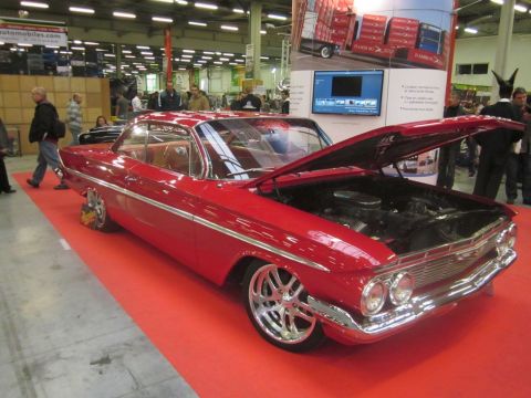 1991 Ford LTD Crown Victoria - Classic 1961 Chevrolet Impala coupe displayed with its hood open, custom wheels and a lowered suspension.