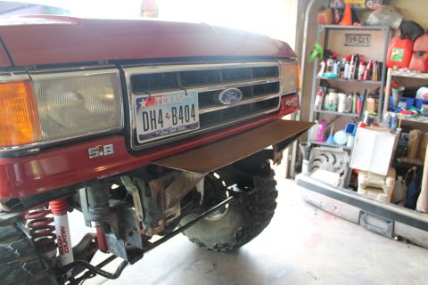 1990 Ford Bronco - Front view of a red 1990 Ford Bronco a custom metal bumper and Texas license plate.