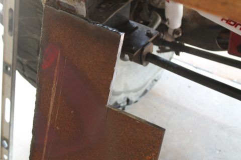 1990 Ford Bronco - Fabricating a custom bumper involves cutting and shaping metal parts for a vehicle.