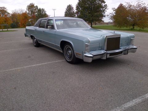2001 Ford Crown Victoria - This 1977 Lincoln Continental Mark V is a large luxury coupe with a distinctive grille and chrome bumper.