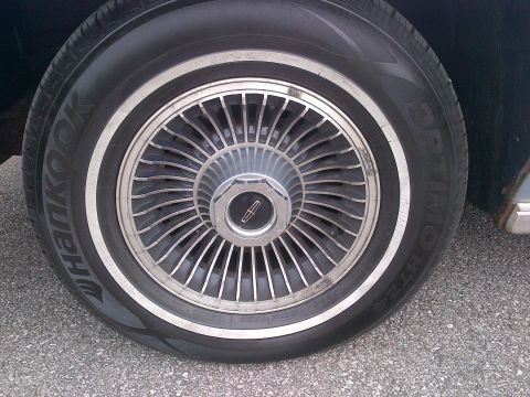 2001 Ford Crown Victoria - This photo shows a close-up of a Lincoln wheel and tire, not a 2001 Ford Crown Victoria.