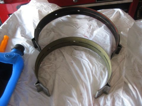 1994 Ford Bronco - Old and new overdrive bands. Note the burnt band. The new one is coated with ATF just like the friction disks.