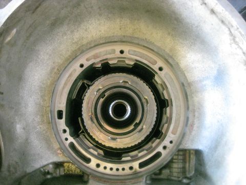 1994 Ford Bronco - Close-up view of a transmission torque converter housing, showing internal mechanical components.