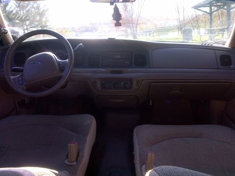 2001 Ford Crown Victoria - Interior view of a 2001 Ford Crown Victoria, including the dashboard and seats.
