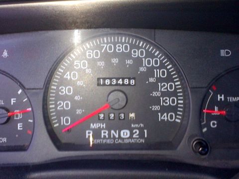 2001 Ford Crown Victoria - Dashboard gauges display mileage, speed, and engine status.