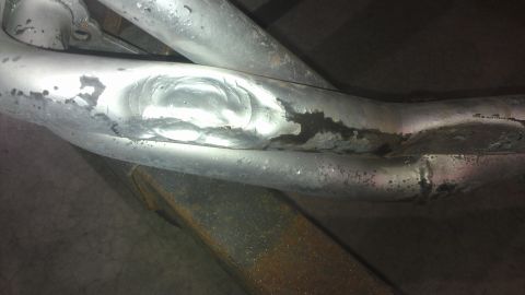 1973 Chevrolet Camaro - Exhaust pipes showing signs of repair and wear.