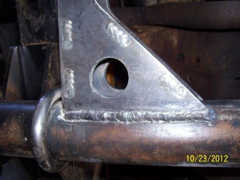 1990 Ford Bronco - Close-up view of a welded metal bracket and tube, with a date stamp visible in the lower right corner.