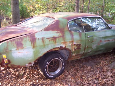 1970 Chevrolet Chevelle - This 1970 Chevrolet Chevelle shows significant rust and wear, viewed from the rear three-quarter angle.