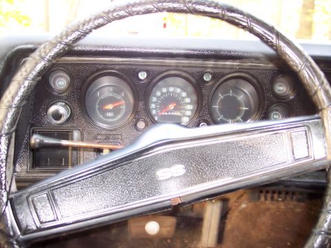 1970 Chevrolet Chevelle - The dashboard of a 1970 Chevrolet Chevelle SS shows the fuel gauge, speedometer, and clock, along with the SS emblem on the steering wheel.