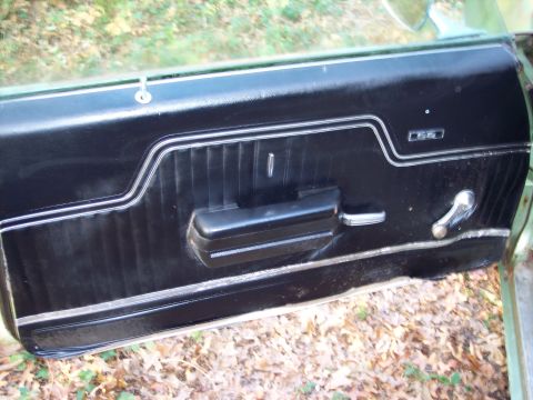 1970 Chevrolet Chevelle - The interior door panel of a 1970 Chevrolet Chevelle features a prominent SS badge and chrome accents.