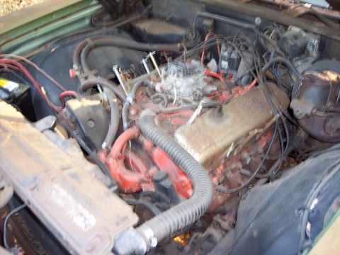 1970 Chevrolet Chevelle - The engine bay of a vehicle, showing the V8 engine components and wiring.