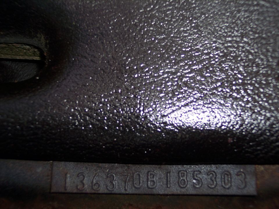 Engine block casting number 136370B185303 stamped into metal