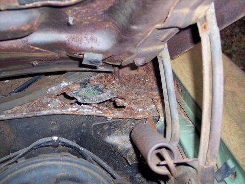 1970 Chevrolet Chevelle - The engine bay shows significant rust and wear on its components.