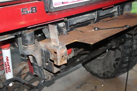 1990 Ford Bronco - Custom bumper fabrication on a 1990 Ford Bronco, showing the "5.8" badge and suspension components.