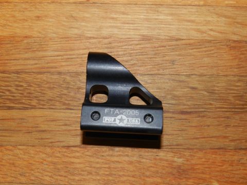 1996 Ford Bronco - A black metal bracket with "FTA-2005" and "POP USA" is shown against a wooden background.