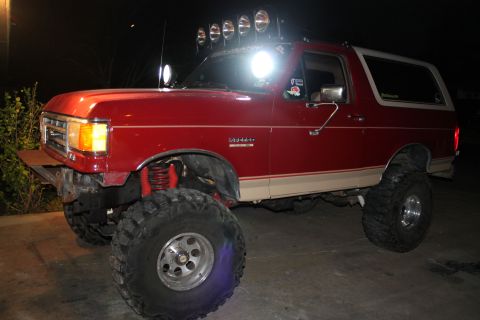 1990 Ford Bronco - This modified 1990 Ford Bronco features an aggressive stance with its lifted suspension and oversized tires.