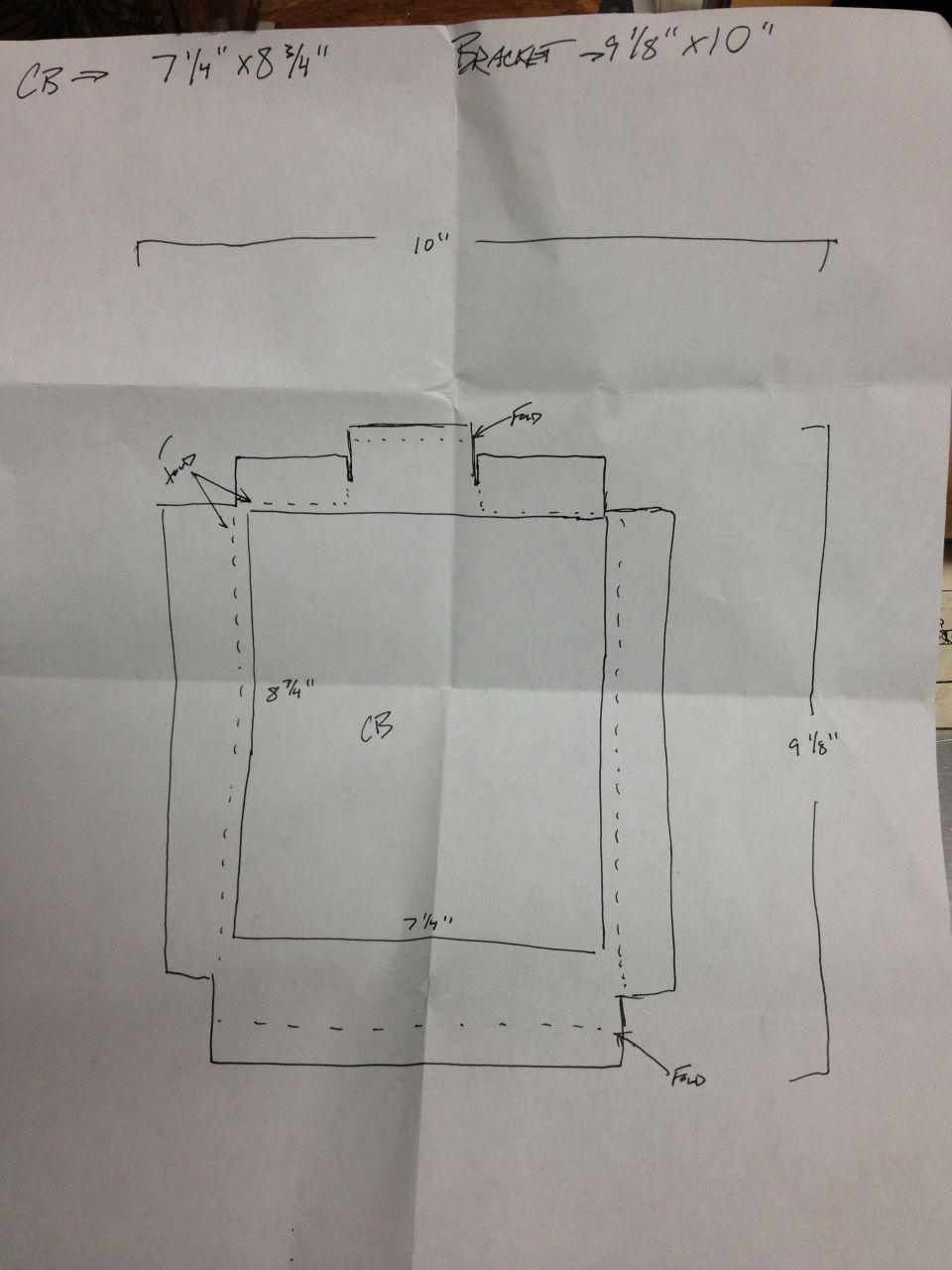 Hand-drawn dimensioned fabrication drawing of a crossmember bracket with measurements