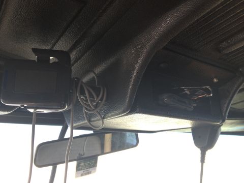 1979 Ford Bronco - A close-up view of the vehicle's interior, focusing on the headliner and a rearview mirror.