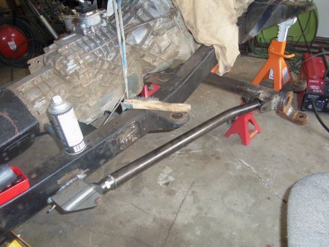 1968 Ford Bronco - Frame and transmission assembly with suspension components, likely undergoing modification or repair.