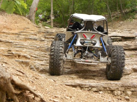 1967 Ford Mustang - This custom buggy navigates a rocky trail, its heavy-duty suspension and off-road capabilities.