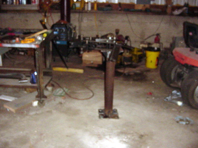 Workshop interior with tools and a red vehicle fender