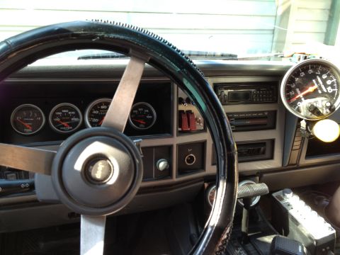 1988 Ford Bronco - Aftermarket gauges and a tachometer are visible inside this Jeep's interior.