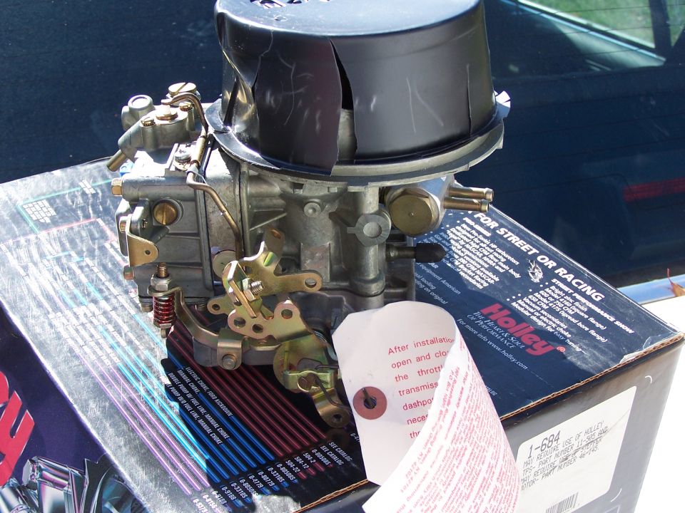 Holley carburetor on its box, with instructions and air cleaner