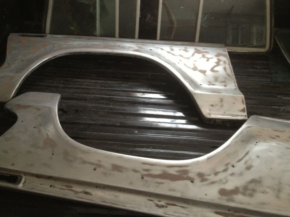 Bare metal fender flares in a truck bed