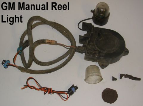1997 Chevrolet Silverado 3500 - ~25' cord with manual crank & manual switch. Magnet pad typically falls off. Bulb-holder retainer latch typically breaks (as shown at cente…