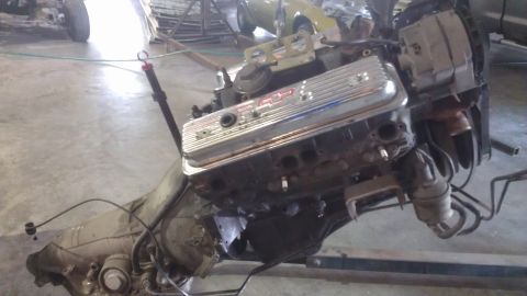 1973 Chevrolet Camaro - A V8 engine and transmission assembly is shown, likely removed from a vehicle for repair or restoration.