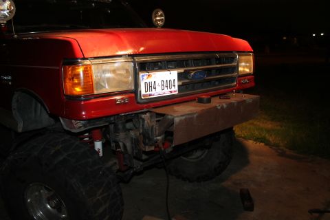 1990 Ford Bronco - Custom bumper installed on a 1990 Ford Bronco, showing the front grille and large tires.