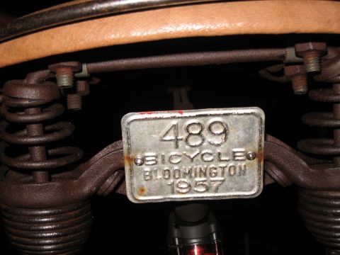 1994 Ford Bronco - A close-up view of a vintage bicycle license plate from Bloomington, dated 1957.